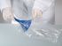 Laboratory Worker Unpacking a Burkle Polystyrene Blue Detectable Disposable Funnel