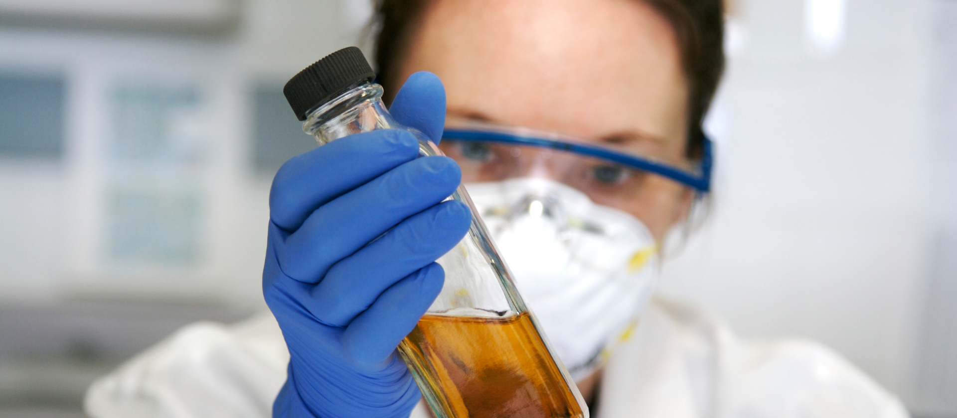 Women Scientist holding bottle